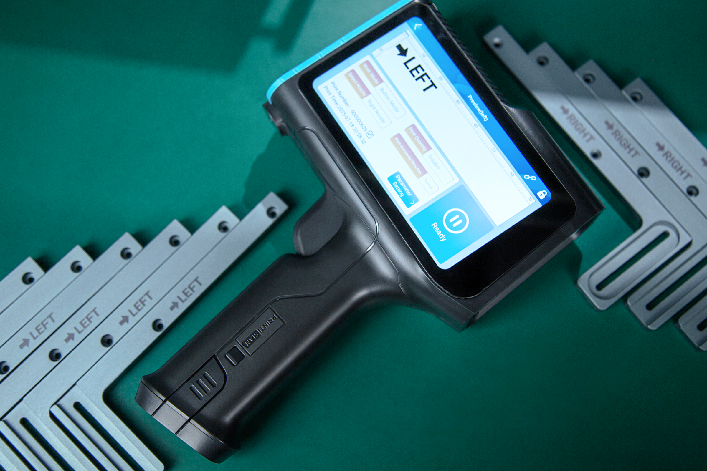 Handheld inkjet printer marking aligned labels on narrow metal strips