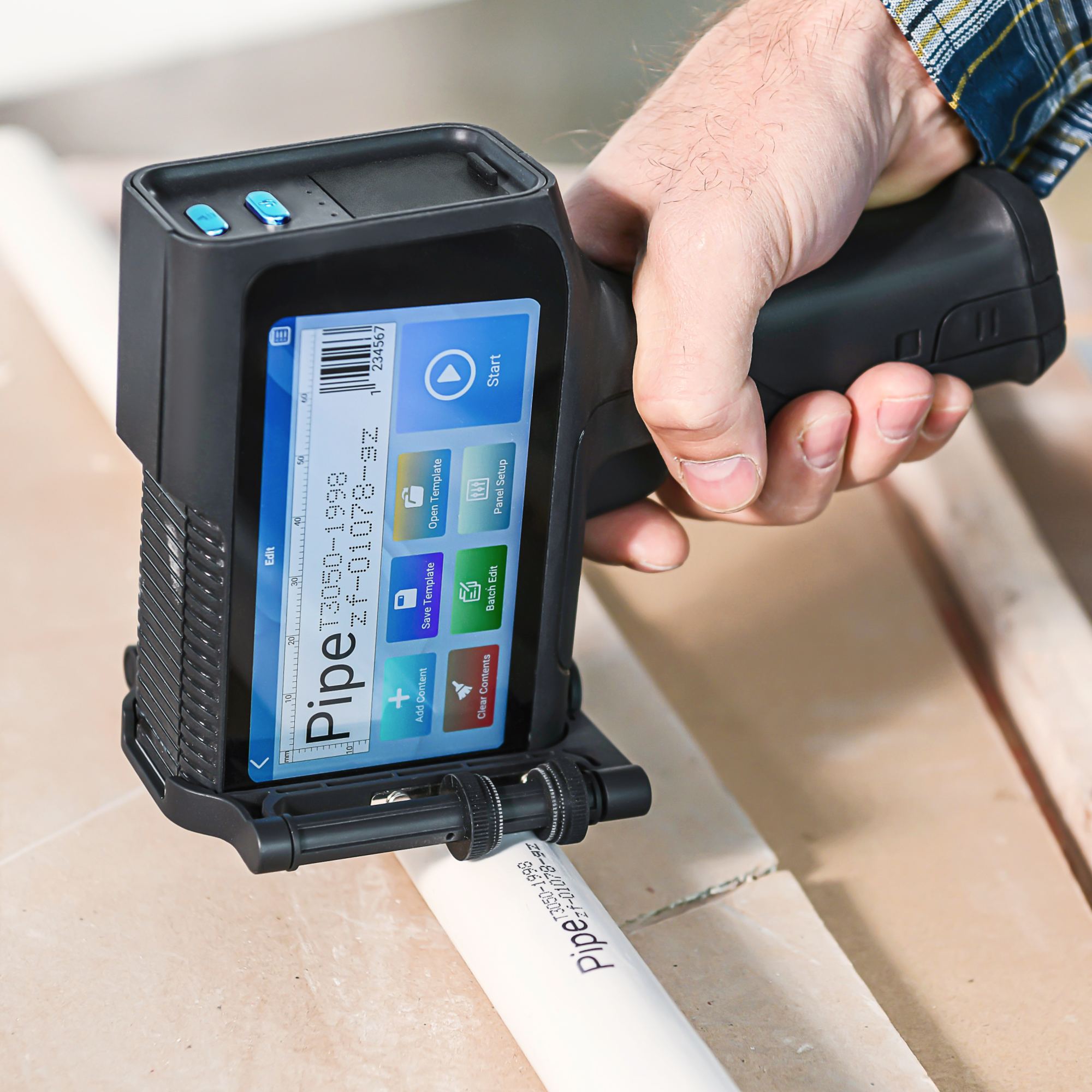 Barcode inkjet printer marking a barcode and code on plastic pipe