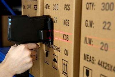 Handheld inkjet printer using dual laser guides for carton coding