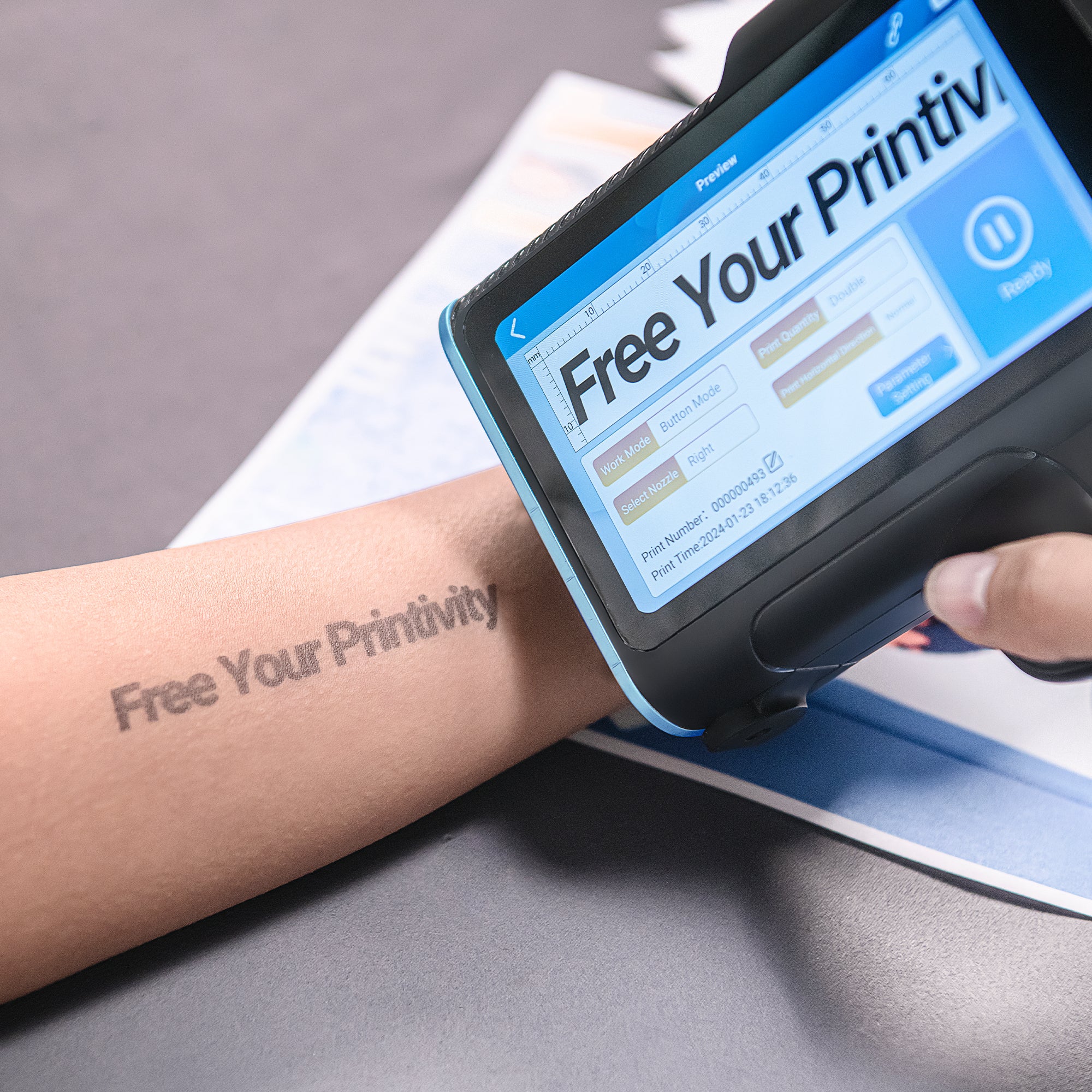 Handheld inkjet printer demonstrating temporary custom printing on skin